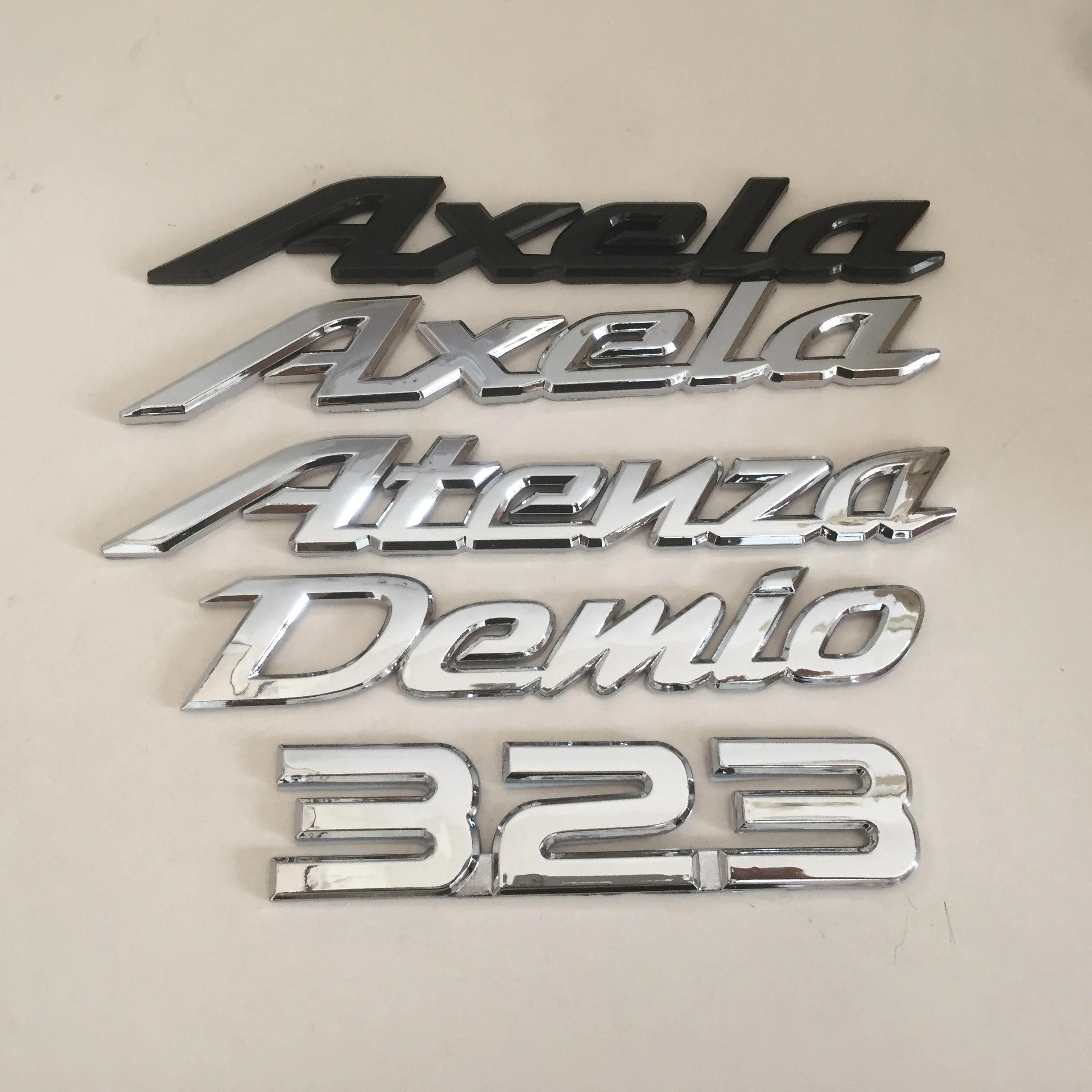 1шт 3D ABS Demio 323 Axela Atenza автомобильная Эмблема С Буквой Задний хвост Наклейки на багажник значок наклейка Для укладки Автоаксессуаров Изображение 0